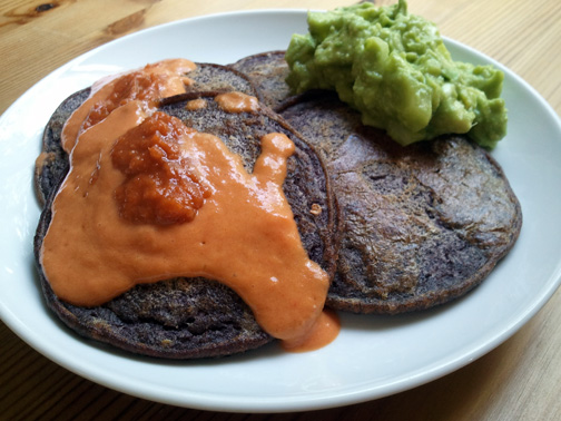 Black Bean Pancakes with a Smoky Roasted Bell Pepper Sauce, Habinero Hot Sauce, and a Chunky Guacamole